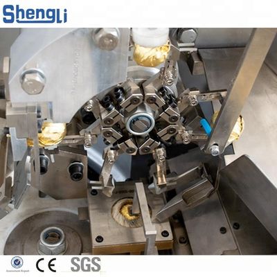 15-32 mm Taille du produit Machine d'emballage complète automatique à bille de galette de chocolat à base de cacahuètes
