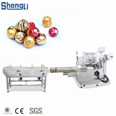 Machine d'emballage multifonctionnelle pour une ligne de traitement personnalisée de boules de galettes de chocolat