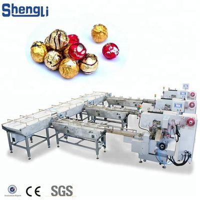 Machine d'emballage multifonctionnelle pour une ligne de traitement personnalisée de boules de galettes de chocolat