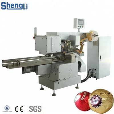 Machine d'emballage multifonctionnelle pour une ligne de traitement personnalisée de boules de galettes de chocolat
