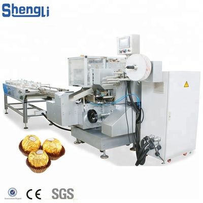 Machine d'emballage multifonctionnelle pour une ligne de traitement personnalisée de boules de galettes de chocolat